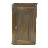 An oak hanging corner cabinet, 70cm wide, and a mahogany chest, with two short and two long drawers,