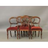 A set of six Victorian mahogany balloon back dining chairs, with drop in seats