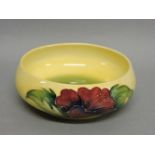 A Moorcroft 'Hibiscus' pattern bowl, yellow ground, 17cm diameter