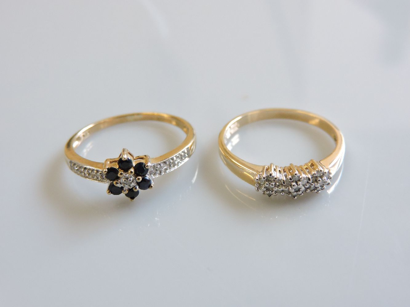 A 9ct gold diamond ring, and a 9ct gold sapphire and diamond ring