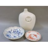 A 20th century Meissen white porcelain bottle vase, and two porcelain plates