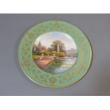 A Royal Worcester plate, titled in script on the back 'The Lake, Branham Park, Yorkshire', and