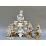 A German porcelain centrepiece, 30cm high, and three Capodimonte biscuit porcelain figurines
