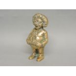 A 19th century bell metal money box, modelled as a smiling Golly wearing a bow tie, 15.3cm