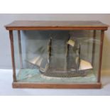 An early 20th century model of a three masted galleon, within a glass display case, case 53cm
