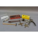 A box of watch repairer's tools, including universal keys and watch back remover
