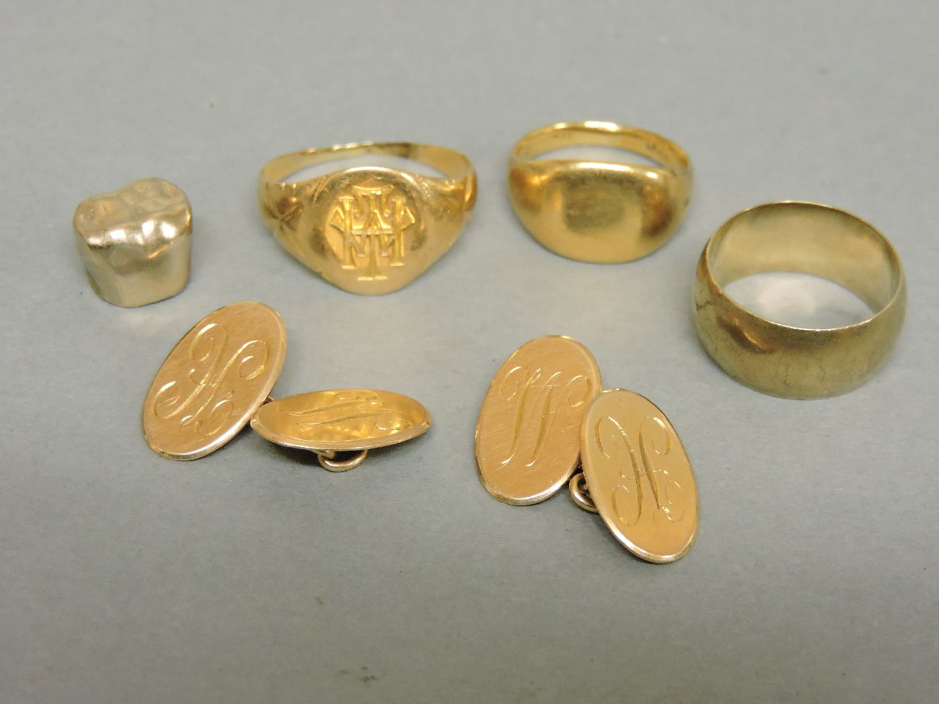 A 9ct gold wedding ring, two gold signet rings, tested as approximately 18ct gold, a pair of 15ct