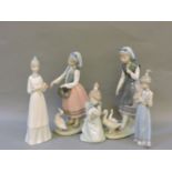 Four Lladro figures, 'Joseph Feeding a Duck' 5201, 'Aracely with Ducks' 5202, 'Sprint Token Girl