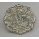 A silvered bronze mirror, Tang dynasty (618-907), the sharply bracketed rim enclosing insects and