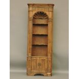 A Georgian pine corner cupboard