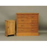 An late Victorian walnut chest of drawers, 104cm wide, and a pot cupboard