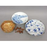 A Japanese Satsuma bowl, Chinese carved wooden beads, and two Chinese blue and white bowls