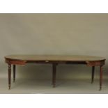 A Victorian mahogany extending dining table, on fluted legs