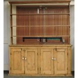 A large Victorian pine dresser, with plate rack back, 198cm wide, 236cm high