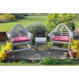 A pair of Lutyens single wooden garden seats, with slatted backs, together with a small matching