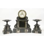 A late 19th century French black marble clock garniture, the clock with drum top, the dial with