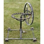 An Edwardian green painted Pluviette Lawn Sprinkler, 77cm high