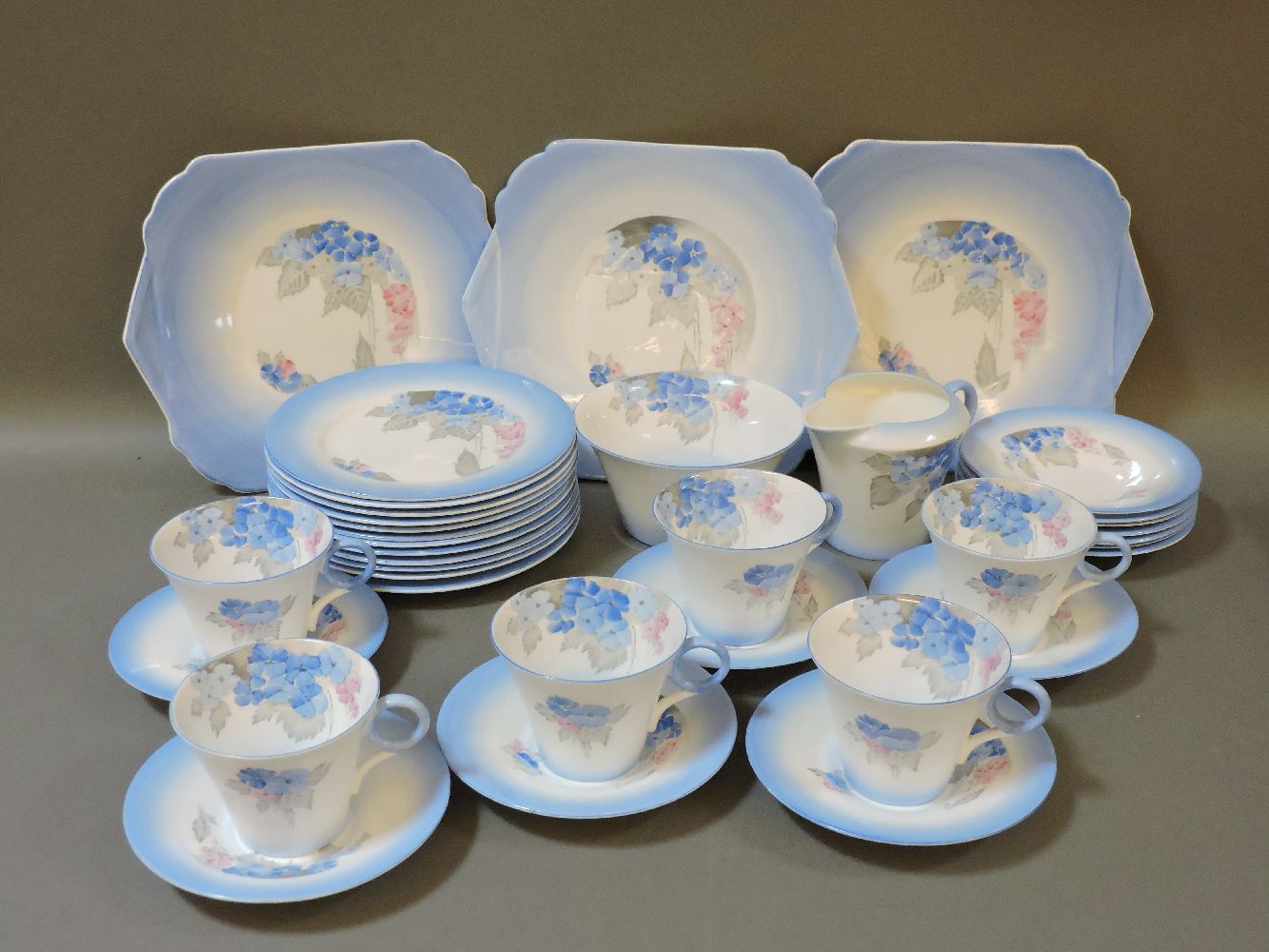 A Shelley teaset, six cups, thirteen saucers, twelve plates, three larger plates, 'W12189', milk