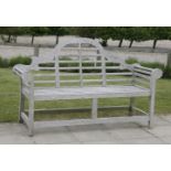 A single Lutyens garden seat, with shaped back and slatted seat, approximately 166cm long