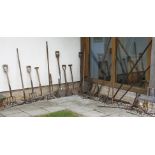 Various old gardening tools, including turfing spades, forks, rakes, etc