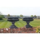 A pair of black painted cast iron shallow campana urns, zinc liners, 55cm diameter, 38cm high