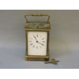 A late 19th century French brass carriage clock, with repeating action, enamel dial with Roman and