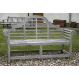 A pair of teak Lutyens style garden seats, with shaped back and slatted seat, each approximately