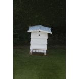 An E H Taylor Ltd white painted beehive, 86cm high