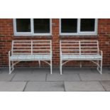 A pair of Regency design fret work and white painted garden seats, each 120cm long