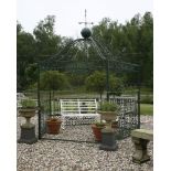 A Victorian style cast iron green painted garden pagoda, the domed top with weather vane finial