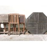 Four modern teak folding garden chairs, a table, and a modern integral garden table and seat