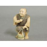 A Japanese netsuke, a mushroom gatherer, signed, 5cm high