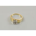 A gold four stone diamond ring, claw set to a square head, stamped 750, 6.2g