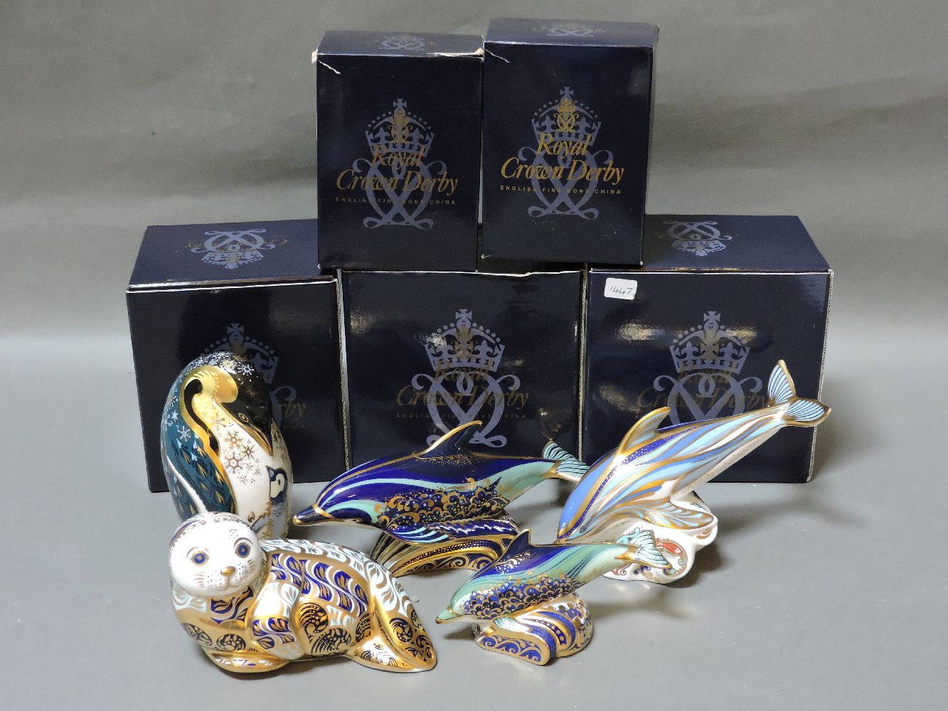 Five various Royal Crown Derby porcelain paperweights, to include Harbour Seal, Lyme Bay Dolphin,