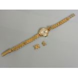 A 9ct gold ladies Jaquet-Droz mechanical bracelet watch, with silvered dial and raised gold and