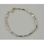 A 9ct gold two colour gold cubic zirconia set bracelet