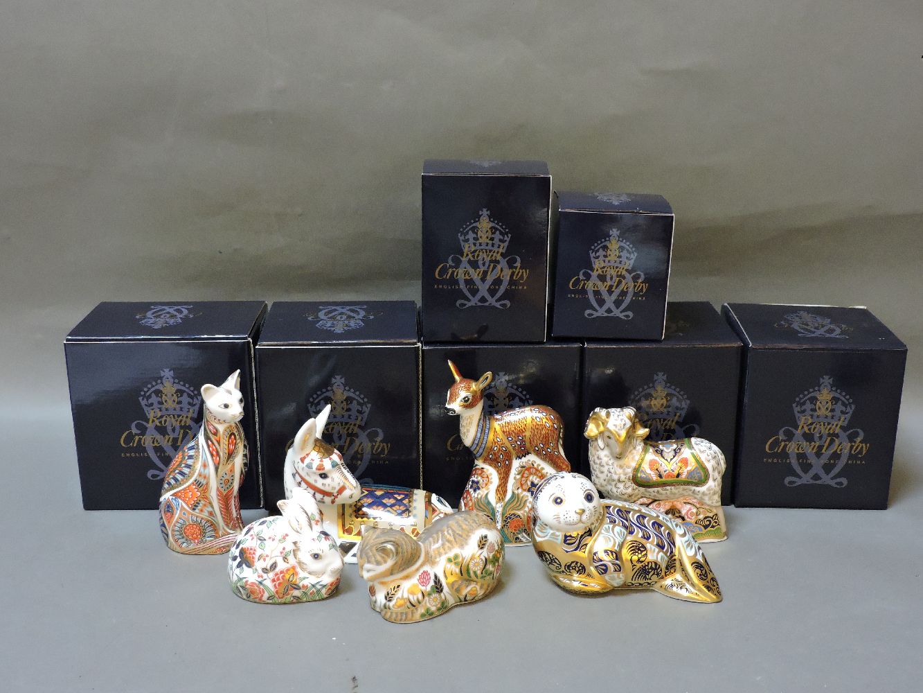 Seven various Royal Crown Derby porcelain paperweights, to include Harbour Seal, Thistle, Meadow