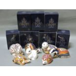 Seven various Royal Crown Derby porcelain paperweights, to include Harbour Seal, Madagascan