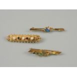 A 9ct gold garnet and cultured pearl brooch, a 9ct gold opal triplet bar brooch, and a gold bar