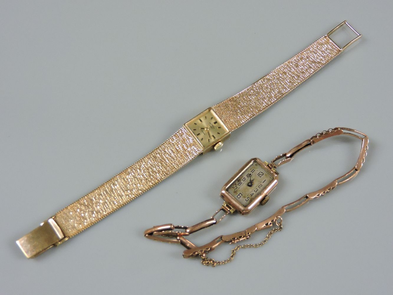 A 9ct gold ladies Rotary mechanical bracelet watch, with raised gilt and black enamel batons and