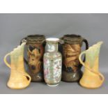 A pair of Bretby 'Chinese' design vases, a pair of Beswick yellow pottery jugs, and a Canton vase