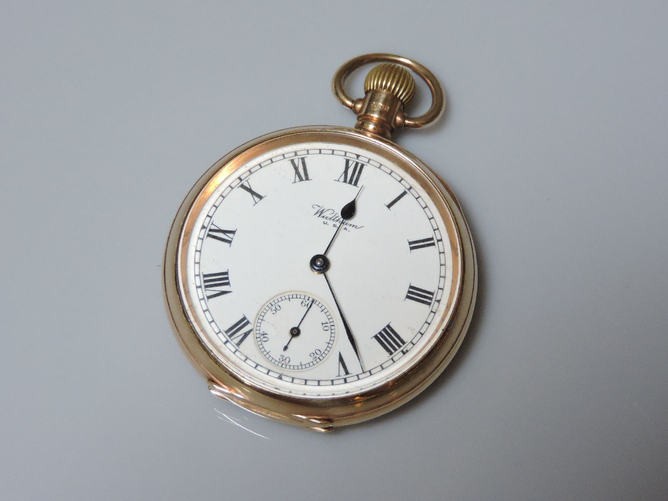 A 9ct gold Waltham USA open faced pocket watch, with presentation inscription to the gold cuvette,