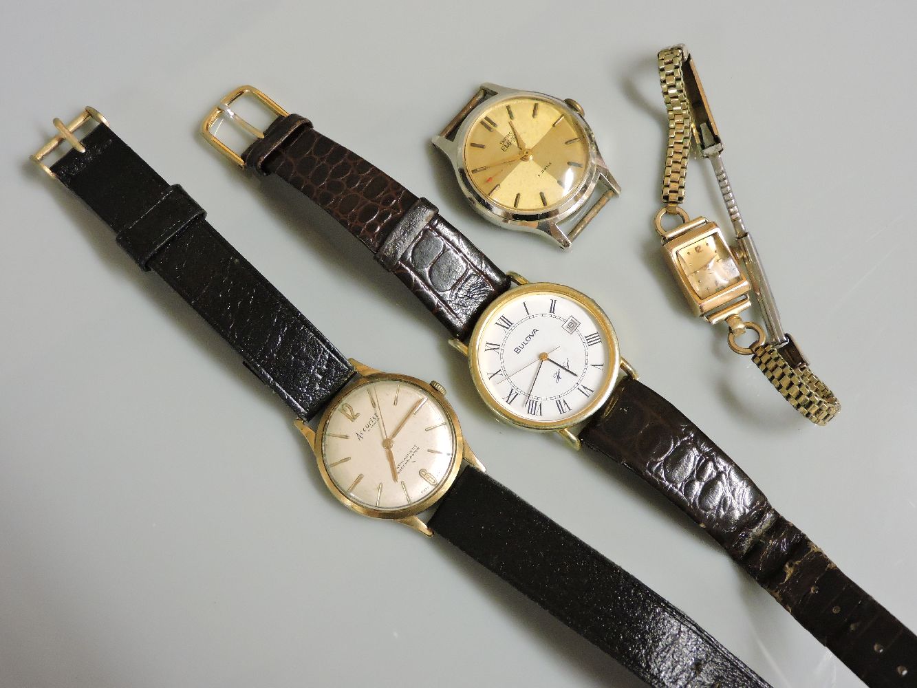 An 18ct gold ladies mechanical strap watch, with later gilt metal bracelet, a 9ct gold gentleman's