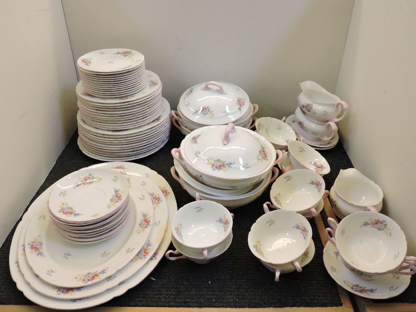 A Shelley dinner service, printed and painted with floral sprays, pattern no 2304, for twelve