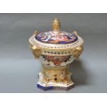 A Crown Derby pot pourri, with a pierced cover and handles, and a pine cone finial, 18cm high