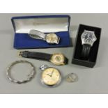 A sterling silver bamboo hinged bangle, a CWC gentleman's quartz strap watch, with black dial and