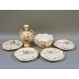Two Royal Worcester twin handled vases, with painted floral pattern on blush ivory ground, shape