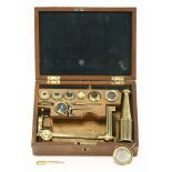A Gould-type compound monocular microscope,mid-19th century, of small size with a tripod folding