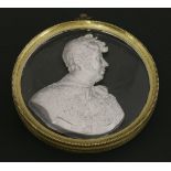 A sulphide Portrait of George IV, in profile, facing right, in a gilt metal mount,9cm diameter1.