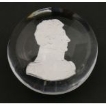 A sulphide Paperweight, 19th century, containing a portrait of an officer in profile, facing right,